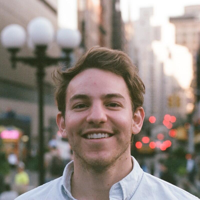 smiling man in city